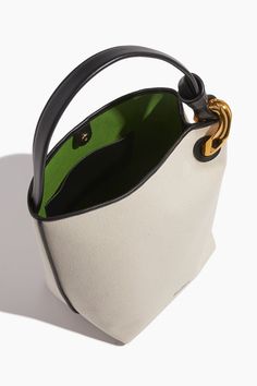 The JW Anderson Corner Bucket Bag will be a staple in your spring and summer wardrobe. This bucket bag is crafted in canvas with their signature chain detail. Bucket bag Top handle Open top Leather piping H: 31cm / W: 23cm / D: 18cm Outer: 80% Cotton, 20% Full Grain Calf Leather Lining: 100% Recycled Cotton Jw Anderson Bag, Bags Inspiration, Basket Bags, Dream Bags, Diamond Bar Necklace, Leather Bag Pattern, Concept Diagram, Bucket Bags, Best Handbags