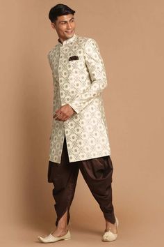 Woven Cream And Copper Color Silk Jacquard Above Knee Length Sherwani, Has A Mandarin Collar, Long Sleeves, Full Front Invisible Button Placket, Straight Hemline, Side Slits, Two Side Pockets, One Welt Pocket And A Pocket Square. Comes With Coffee Color Solid Cowl Dhoti Pant, Has Elasticated Waistband With Drawstring Closure. Product Features: Top Color: Beige Bottom Color: Coffee Top Fabric: Silk Blend Bottom Fabric: Viscose Blend Print And Pattern : Woven Design, Self Design Weave Pattern And Mens Sherwani, Lavender Silk, Sherwani For Men, Dhoti Pants, Print And Pattern, Coffee Color, Beige Top, Weave Pattern, Self Design