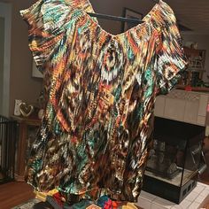 Selling A Size Xl Top With Lots Of Browns , Oranges . Greens , And White Going Thru It And It Is Like A Crinkle Material. Like Brand New And Made By Rrt And Soul . Beach Tops With Crinkle Texture And Short Sleeves, Casual Crinkle Texture Top For Vacation, Bohemian Crinkle Texture Tops For Summer, Casual Orange Blouse With Vibrant Print, Brown Orange, Shirt Color, Colorful Shirts, Womens Tops, Brand New