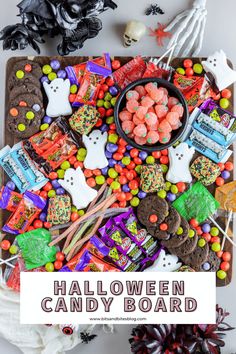 halloween candy board with lots of candies on it