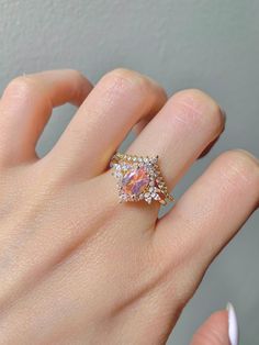 This gorgeous, timeless ring features our favorite Morganite design and hand picked crystals. This is a 2 piece set. ✦ DETAILS ✦ ✧ Handcrafted ✧ 1.60 Carat center stone ✧ Morganite and crystals ✧ Sizes 3.75-11.25 ✧ Sterling Silver 925 ✧ This ring will arrive ready to gift in a Kherish Jewelry Pouch. ✧ PRE-ORDER: Items that are preorder only will ship within 10-15 business days. You will receive an email with the updated processing time if you order a size/option that qualifies for pre-order. ✧ D Fine Jewelry Crystal Promise Ring With Sparkling Stones, Gold Cluster Ring With Cubic Zirconia Accent Stones, Fine Jewelry Rose Gold Rings With Sparkling Stones, Dazzling Gold Topaz Wedding Ring, Fine Jewelry Rings With Sparkling Stones For Gifts, Dazzling Rings With Sparkling Stones As Gift, Gold Marquise Crystal Ring For Anniversary, Cubic Zirconia Cluster Ring With Sparkling Stones As Gift, Fine Jewelry Crystal Ring With Sparkling Stones For Wedding