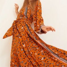 So Comfy And Flattering Orange Long Sleeve Maxi Dress For Summer, Orange Long Sleeve Maxi Dress For Vacation, Bohemian Orange Maxi Dress For Spring, Orange Long Sleeve Printed Maxi Dress, Spring Orange Boho Print Maxi Dress, Orange Printed Spring Dress, Orange Printed V-neck Midi Dress, Orange V-neck Printed Midi Dress, Orange Bohemian Boho Dress With Floral Print