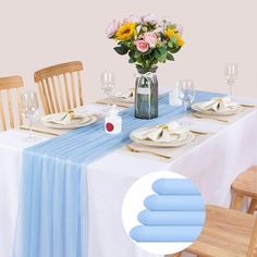 a dining table set with place settings and flowers in a vase on the centerpiece