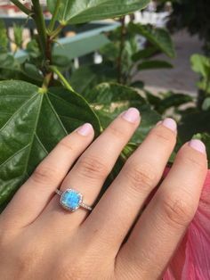 A delicate and beautifully crafted lab created light blue opal ring.Or New White opal This beautiful and feminine ring for her is set in sterling silver with halo micro CZ stones all the way around. We use the finest AAA quality micro CZ's on each side of the band and all the way around framing the brilliant sparkly opal. This ring makes for a gorgeous alternate engagement ring, a promise ring or just an everyday pretty ring for yourself! Your ring is cast with the purest 925 Sterling silver and Halo Band, Blue Opal Ring, White Opal Ring, Opal Band, Pretty Ring, Cz Rings Engagement, Palm Beach Fl, Alternative Engagement Rings, Ring Blue