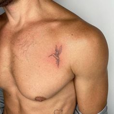 a man with a hummingbird tattoo on his chest