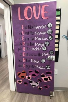 a purple door decorated with pink and black letters that spell out the names of people in different languages