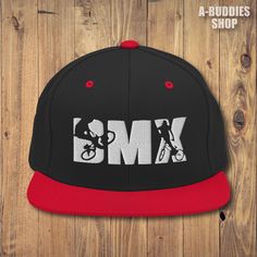 Do you ride BMX? Then this is a perfect snapback hat with an embroidered BMX design for you and your BMX friends and colleagues. Overview: - Embroidered Design - Structured with a classic fit - Adjustable snap closure - Head circumference: 21⅝″-23⅝″ (54.9 cm-60 cm) - Green undervisor Details: - 80% acrylic, 20% wool - Green Camo is 60% cotton, 40% polyester - Structured, 6-panel, high-profile - 6 embroidered eyelets - Plastic snap closure Care instructions: - Machine washable at 30oC (86oF) or less on gentle cycle - Do not use bleach - Hang to dry to ensure longevity - If you must use a dryer, dry on low. This product is made especially for you as soon as you place an order, which is why it takes us a bit longer to deliver it to you. Making products on demand instead of in bulk helps reduc Urban Skateboarding Baseball Cap, Adjustable Snapback Baseball Cap For Skateboarding, Adjustable Flat Brim Baseball Cap For Skateboarding, Adjustable Snapback Trucker Hat For Skateboarding, Urban Adjustable Snapback Hat For Skateboarding, Hip Hop Baseball Cap For Skateboarding, Adjustable Flat Bill Snapback Hat For Skateboarding, Hip Hop Style Baseball Cap For Skateboarding, Hip Hop Cap For Skateboarding