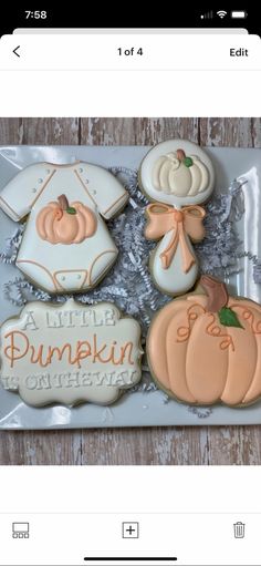 some decorated cookies are sitting on a plate