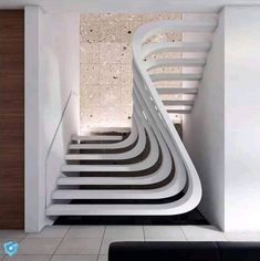 there is a very long white staircase in the house with black and white stripes on it