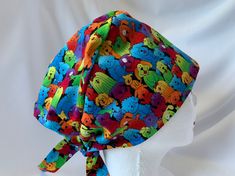 "This tie back pixie style hat is made of 100% cotton. Front band can be turned up if your head is smaller than average. The front to the crown measures 6\". Ties measure 8.5\". Fits most head sizes. Most ponytails fit nicely in the crown. Small piece of elastic in back of crown makes room for ponytail.  We have a smoke and pet free shop. The fabric has been washed and dried in dryer prior to construction. Seams are finished throughout.   This fabric is brightly colored dogs.  Yours may be a sli Pixie Styles, Scrub Hat, Scrub Hats, Scrub Caps, Tie Backs, Tie Back, The Crown, Free Shopping, Hat Fashion