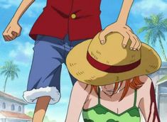 a woman in a bathing suit and straw hat standing next to a man wearing a red shirt