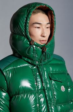 The iconic house codes established with Moncler's landmark 1954 Karakorum down jacket still influence this reimagined version made of glossy lacquered nylon. The hood and sleeves are all removable, letting you adjust the level of warmth required, and interior shoulder straps let you carry the jacket on your back. Front zip closure with double snap storm placket Stand collar; removable drawcord hood Zip-off sleeves with adjustable snap-tab elastic cuffs Chest snap-flap patch pocket; front zip poc Moncler Puffer Jacket, Red Moncler Jacket, Moncler Palm Angels Jacket, Moncler Maya 70 Short Down Jacket, Moncler Light Up Jacket, Down Jackets, Green Fits, Ripstop Fabric, Icon Collection