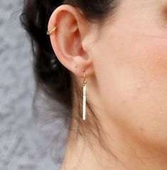 Modern, elegant simple, gold filled bar earrings. Minimalist jewelry, minimalist earrings. Hand hammered gives them a little sparkle. **Gold filled hammered bar is 1.2" inches (30mm) long width is 2mm **Overall earring length is 1.5" ------------------------- MATERIAL GOLD FILLED ! 100% quality 14k gold filled. More durable and longer lasting than any gold plated items. Gold-filled is composed of a solid layer of gold (typically constituting at least 5% of the item's total weight) mechanically b Minimalist Everyday Linear Earrings With Hammered Detail, Everyday Minimalist Hammered Linear Earrings, Minimalist Hammered Long Drop Earrings, Minimalist Hammered Dangle Linear Earrings, Gold Bar Earrings, Rectangle Earrings, Jewelry Minimalist, Long Dangle Earrings, Hammered Gold