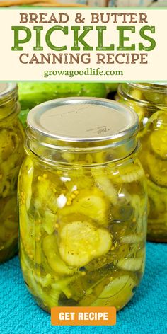 two jars filled with pickles sitting on top of a blue towel