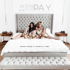 three women and two children laying on a bed with the words monday written across it