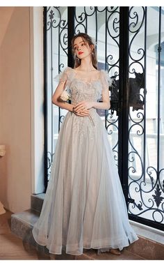 off the shoulder feather dress 1386-007 Gray Prom Evening Dress For Prom Season, Gray Evening Dress For Prom, Feathered Floor-length Prom Dress, Floor-length Feather Trim Evening Dress For Wedding, Floor-length Feathered Evening Dress, Floor-length Feathered Prom Dresses, Feathered Evening Dress For Prom, Feather Prom Dress, White Sequin Dress