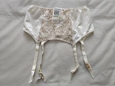 A Vintage NWT Suspender/Garter Belt by Warner's Lingerie from their lovely 'Richness' range, in size 10-12/Aus/UK, 5-6/US, in an all cream/taupe nylon and lace finish. Quadruple clasp on back and 4 suspenders. Colour - Off White Vintage Garter, Vintage Suspenders, Garter Belts, Suspender Belt, Vintage Lingerie, Socks And Hosiery, Suspenders, Hosiery, Art Reference