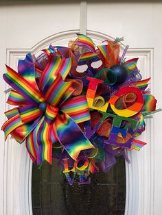 a colorful wreath on the front door of a house