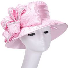 Introducing the exquisite Giovanna HD1561-PNK Church Hat, a beautiful accessory that is sure to add a touch of elegance and grace to any ensemble. Designed with care and attention to detail, this hat boasts a luxurious floral pattern that epitomizes style and femininity. The eye-catching pink hue makes a bold statement, complementing a range of outfits and occasions from church services to special events. The Giovanna HD1561-PNK is not just about looks; it is also designed for comfort. Crafted f Feminine Mini Hats For Weddings, Feminine Adjustable Hat With Short Brim, Pink Adjustable Cloche Hat For Spring, Feminine Pink Hats For Spring, Feminine Adjustable Pink Hat, Feminine Pink Adjustable Hat, Pink Feminine Hat With Adjustable Fit, Feminine Pink Spring Hats, Feminine Pink Hat With Curved Brim