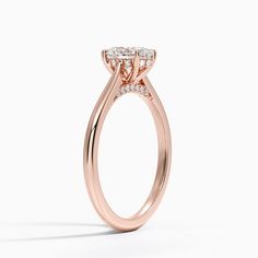 Oval Shaped Dawn Diamond Engagement Ring - 14K Rose Gold. This stunning ring features a petite band that sweeps up to embrace the gemstone in delicate claw prongs. Diamond accents adorn the gallery wire and bridge adding a unique touch to a classic look (1/10 total carat weight). 
 
 Our perfect fit engagement rings are carefully designed to sit flush against a variety of wedding rings for a seamless look with no gaps. Classic 14k Rose Gold Halo Rings, Classic 14k Rose Gold Rings With Halo Design, Rose Gold Marquise Ring With Prong Setting, Rose Gold Marquise Ring For Formal Occasions, Formal Marquise Rose Gold Ring, Formal Rose Gold Marquise Ring, 14k Rose Gold Solitaire Diamond Ring For Formal Occasions, Elegant Oval Solitaire Halo Ring, Rose Gold Solitaire Ring Marquise Cut