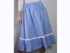 "This skirt is perfect! Nice weight chambray cotton 70s midi with a full shape and ruffle hem trimmed in white daisy Broderie Anglais. Lace up bodice style front with a zip and button at the back.  Excellent vintage condition hardly worn.  Waist 28\" Length 29\"  Matching prairie blouse available for a full set." Cotton Skirt With Ruffle Hem For Daywear, Peasant Cotton Skirt With Ruffles, Peasant Cotton Skirt For Spring, Spring Cotton Peasant Skirt, Cotton Peasant Skirt For Spring, Cottagecore Cotton Skirt With Ruffles, Vintage Skirt With Ruffle Hem For Spring, Vintage Spring Skirt For Daywear, Vintage Spring Daywear Skirt