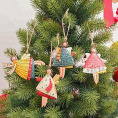 christmas ornaments hanging from the top of a tree