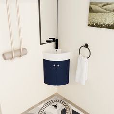 a bathroom with a sink, towel rack and toilet paper dispenser on the wall