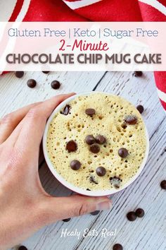 a person holding a bowl of chocolate chip mug cake with the text gluten free keto sugar free 2 - minute chocolate chip mug cake