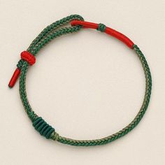 Woven bracelet adjustable with braided rope knot. The design of this bracelet is simple yet functional as you can easily style or personalize it with adding your own charms or beads. Cheap Green Jewelry With Sliding Knot, Cheap Green Braided Bracelet For Women, Casual Red Braided Bracelet, Casual Braided Bracelet, Casual Braided Bracelet Jewelry, Casual Red Braided Waxed Cord Bracelets, Casual Resizable Braided Friendship Bracelets, Casual Braided Friendship Bracelet With Sliding Knot, Casual Braided Everyday Bracelets