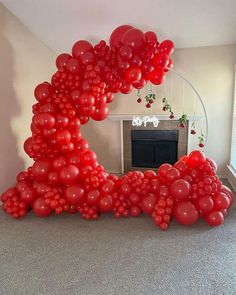 a bunch of balloons that are in the shape of a letter on top of a floor