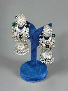 Unleash your Dandiya style with our stunning Silver lookalike Jhumka Earrings! Elevate your outfit with a touch of elegance and add a unique flair to your Navratri look. These exquisite jhumkas will definitely turn heads at garba events. Don't miss out on this must-have accessory! Traditional Designer Earrings For Diwali, Designer Chandbalis For Diwali, Traditional Festive Earrings, Festive Designer Earrings With Cutdana, Festive Designer Earrings With Latkans, Bollywood Style Chandbali Earrings For Designer Wear, Festive Designer Latkan Earrings, Festive Cutdana Earrings For Designer Wear, Traditional Festive Designer Earrings