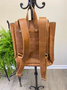 Women's Cowhide Travel Backpack Handcrafted rucksack made from full-grain cowhide Size: 13" (H) x 8" (L) x 5" (W) Distressed Hunter Backpack Perfect for daily use / school / short adventures storing up to 12" Laptop , Cell Phone and other accessories Can be used as Leather backpack, iPad bag, laptop bag, leather school bag, rucksack, adventure bag, travel bag, college bag For men and women Fits up to 12" Devices: Introducing our premium Full Grain Cowhide Leather Backpack, a stylish and durable Mens Leather Messenger Bag, Hunter Backpack, Leather Studio, Leather School Bag, Leather Messenger Bag Laptop, Adventure Bags, Messenger Bag Leather, Bag College, Women Backpack Travel