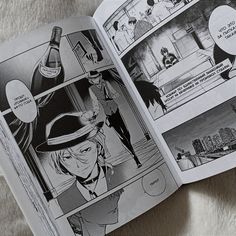 an open comic book with cartoon characters inside