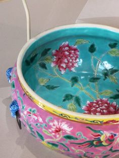 a colorful bowl with flowers painted on it