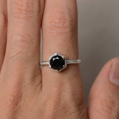 This is a gorgeous handmade creation. Its beauty is its simplicity & Elegance. The 7*7mm round cut natural black spinel is crafted in solid sterling silver and with rhodium plated. It is available to customized, if you have any mind, just let me know, we will discuss with it. All item is sent in a beautiful gift box You can realize more lovely stuff clicking the link https://www.etsy.com/shop/knightjewelry?refshopsection_shophome_leftnav Please leave the correct address and you PHONE NUMBER Black Anniversary Rings, Black Round Sapphire Ring For Anniversary, Gift Rings With Black Diamonds In Round Cut, Gift Black Diamond Round Ring, Black Solitaire Ring As Gift, Black Diamond Rings In Sterling Silver, Gift Black Diamond Round Cut Ring, Classic Rings With Black Diamonds As Gift, Classic Rings With Black Diamonds For Gift