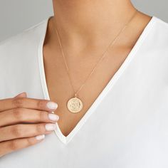 LILY & ROO's large round St Christopher medallion necklace in solid gold. This stunning large St Christopher medallion is suitable for everyday wear and perfect for layering. The large round pendant necklace features the patron saint of travellers. The perfect gift for her. All solid gold St Christophers come in a luxury LILY & ROO gift box. Give your jewellery a little TLC to keep your jewellery shining bright. Your stunning St Christopher necklace will be sent to you in a complimentary Lily & Roo gift box. 14k Gold Round Coin Necklace Fine Jewelry, 14k Gold Medallion Necklace With Round Pendant, Fine Jewelry Medallion Coin Necklace, 14k Gold Round Coin Necklace, Yellow Gold Coin Pendant Necklace, Yellow Gold Round Pendant Coin Necklace, Yellow Gold Medallion Necklace With Cable Chain, Yellow Gold Round Pendant Coin Necklace Fine Jewelry, Yellow Gold Coin Necklace With Round Pendant