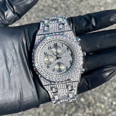 Step into elegance with this iced-out diamond timepiece that mirrors genuine luxury watches. We utilize premium simulated diamonds crafted from high-refractive crystals, ensuring a sparkle that rivals authentic diamonds under the light! INCLUDES AN EASY-TO-USE SIZE ADJUSTMENT TOOL Specifications: - Gender: Men's  - Case Size: 43mm - Movement: Quartz Movement - Battery: Included - Sizing: 8.5-inch band - Adjustable: Links are removable to fit your wrist - Back: Stainless Steel - Lock: Fold-over Clasp - Stone: VVS Diamond Simulate - Case Material: Alloy - Finish: Gold/Silver Plating  Whether you're dressing up for casual days, events, or gifting someone special on occasions like Graduations, Valentine's Day, Anniversaries, Birthdays, Thanksgiving, Christmas, New Year, or Father's Day, this w Silver Diamond Watch With Subdials And Cubic Zirconia, Silver Watch With Cubic Zirconia And Subdials, Silver Cubic Zirconia Watch With Subdials, Round Diamond Watch With Bling, Diamond Bling Watch, Iced Out Diamond Jewelry And Watches For Gifts, White Gold Diamond Watch With Bling, Cubic Zirconia Diamond Watch With Bling, Iced Out Diamond Watch As A Gift