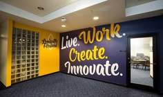 an empty room with yellow and purple walls that says live work create innovate