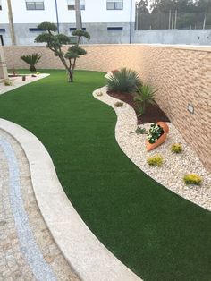 an artificial lawn in front of a building