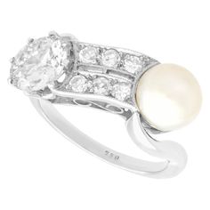 an antique style pearl and diamond ring