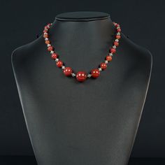 This lovely light weight Carnelian Choker graduates from a 15mm center bead down to 5mm for easy wearing. The clear faceted 5mm crystals are antique. Traditional Carnelian Necklace With Polished Beads, Traditional Carnelian Oval Bead Necklaces, Traditional Carnelian Oval Beads Necklace, Carnelian Choker, Antique Carnelian Beaded Necklace, Vintage Brown Carnelian Necklace, Beaded Necklaces, Choker, Beaded Necklace