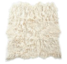 a white sheepskin rug on a white background