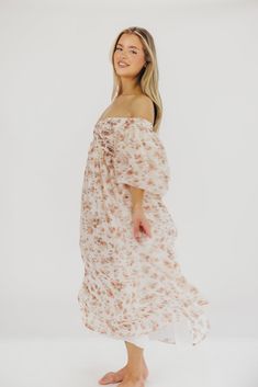 This gorgeous dress is a *vibe* and we are here for it. If you think the Harlow is stunning in photos, wait till you see it in person - this dress will make a statement wherever you go! It features incredible puffed sleeves, a bustier-style structured bodice, and a voluminous skirt. This floral gem is extra-luxe, and 100% the choice when you're looking to stand out from the crowd. Pair it with a glam set of pumps for a night at the symphony, or with heeled sandals for a baby shower - just prepar Summer Dress With Flowy Skirt For Casual Occasions, Summer Dress With Flowy Skirt For Casual Wear, Flowy Off-shoulder Midi Dress For Casual Wear, Summer Midi Length Wedding Dresses, Spring Off-shoulder Flowy Dress, Spring Off-shoulder Dress With Flowy Skirt, Spring Flowy Off-shoulder Dress, Feminine Flowy Skirt Dress For Beach, Feminine Flowy Beach Dress