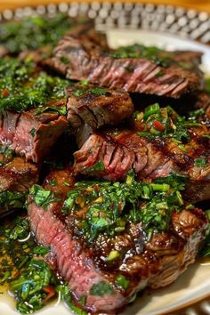 a plate with steak and greens on it