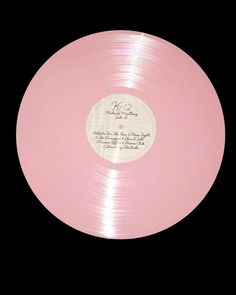 a pink record with writing on it