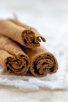 cinnamon sticks are stacked on top of each other