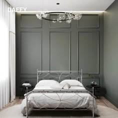 a white bed sitting under a chandelier in a bedroom