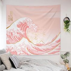 a tapestry hanging on the wall above a bed