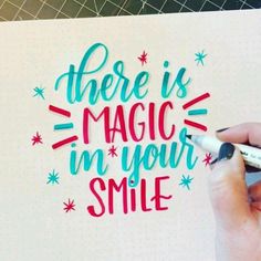 there is magic in your smile written on a piece of paper with marker and pen