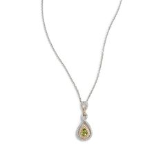 Chartreuse Drop Pendant is centered on a pear shaped peridot, and opulently embellished with a double rowed twist of diamonds in 18k white gold. Chain is included. Elegant Green Pear-shaped Diamond Necklace, Elegant Green Necklace With Pave Setting, Elegant Peridot Jewelry For May Birthstone, Green Teardrop Jewelry Brilliant Cut, Green Teardrop Jewelry With Brilliant Cut, Green Teardrop Brilliant Cut Jewelry, Green Briolette Diamond Jewelry, Green Pear-shaped Diamond Jewelry, Elegant Green Jewelry With Pave Setting